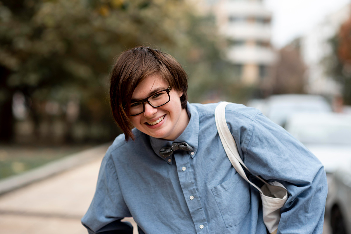 Teen smiling happily outdoors