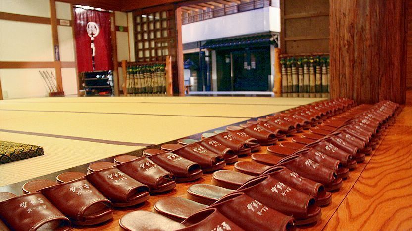 Japanese genkan with slippers arranged for entry